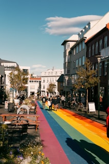 A vibrant city street redesigned with green infrastructure and inclusive pedestrian pathways.