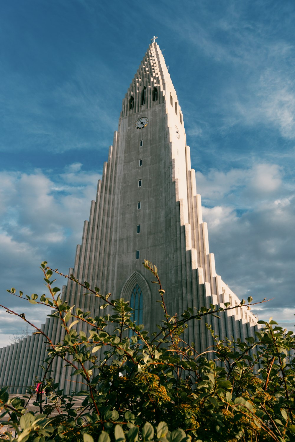 a very tall building with a clock on it's side