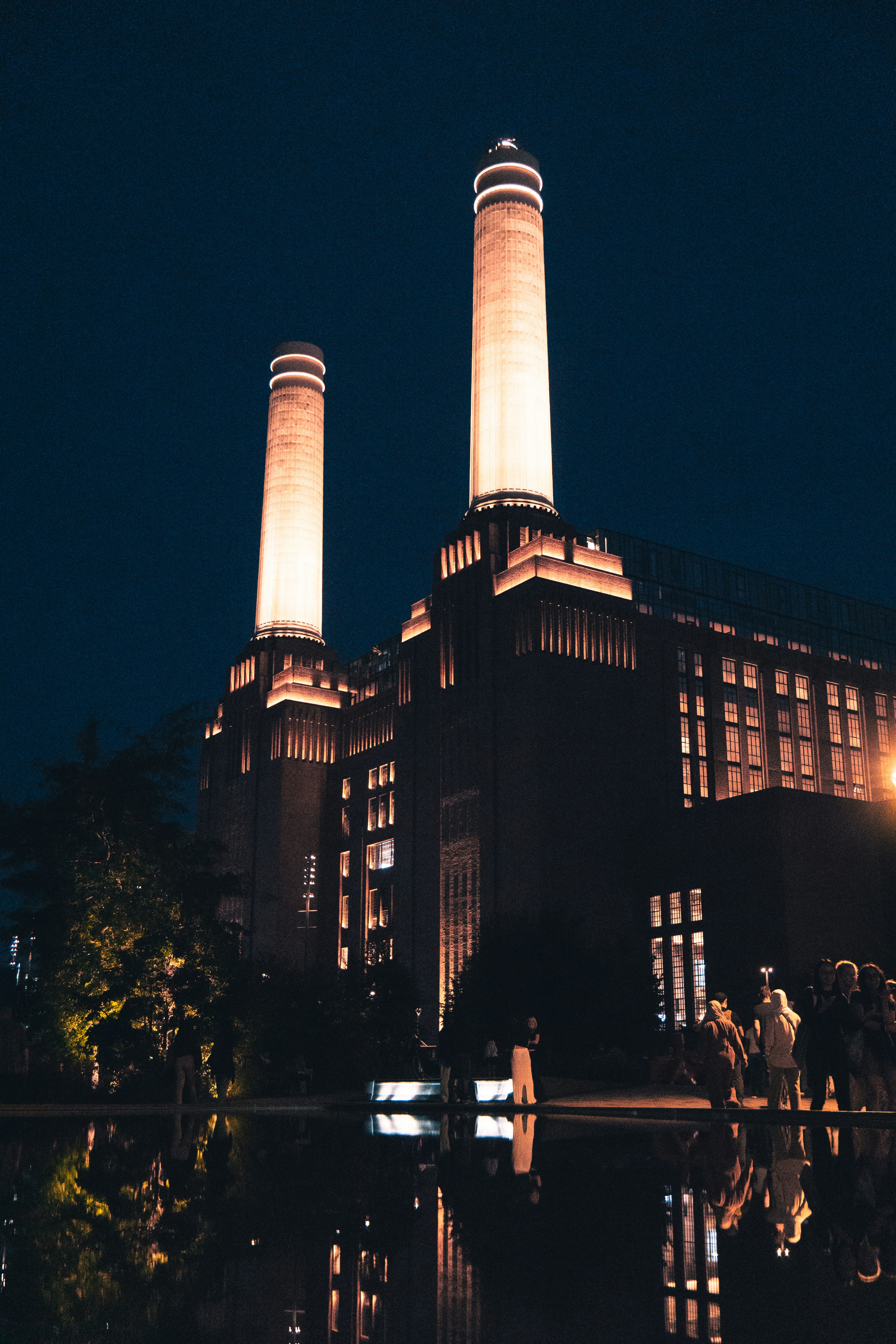 a couple of people standing in front of a building