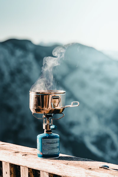 a pot on a burner with smoke coming out of it