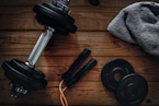 a pair of dumbbells, a towel and a pair of dumbbells