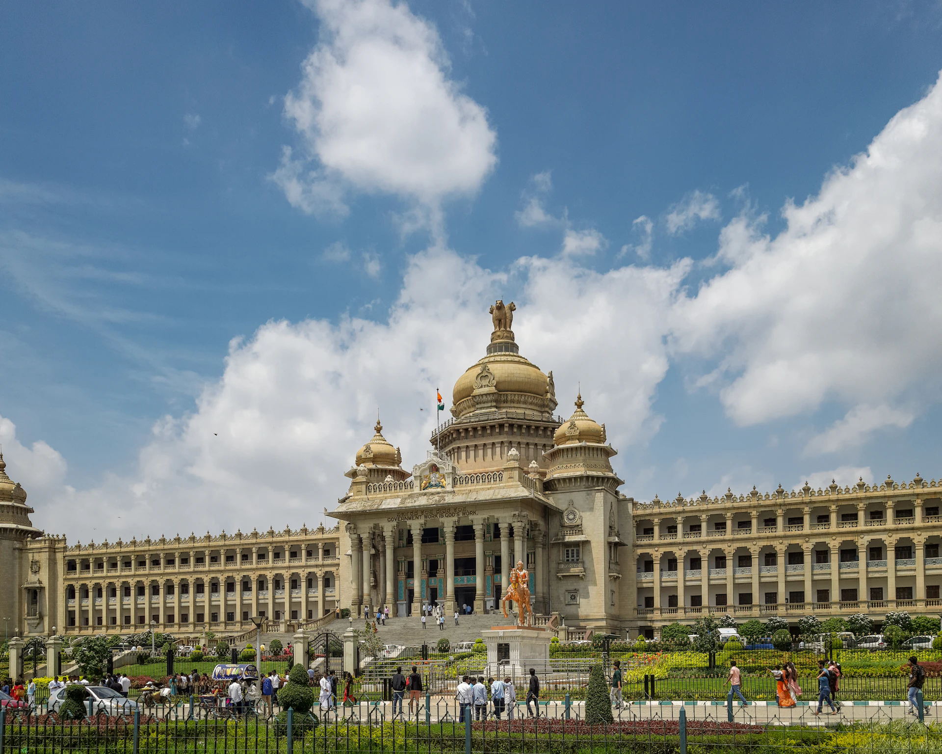 The Vidhana Soudha in Bengaluru beneath a wide blue sky