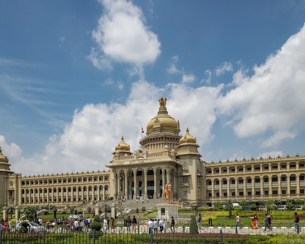 a large building with a lot of people around it