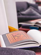 A spread of open coloring books showing diverse creative designs.