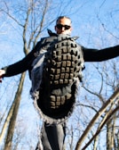 An action shot of someone wearing nov zero rubber shoes outdoors.