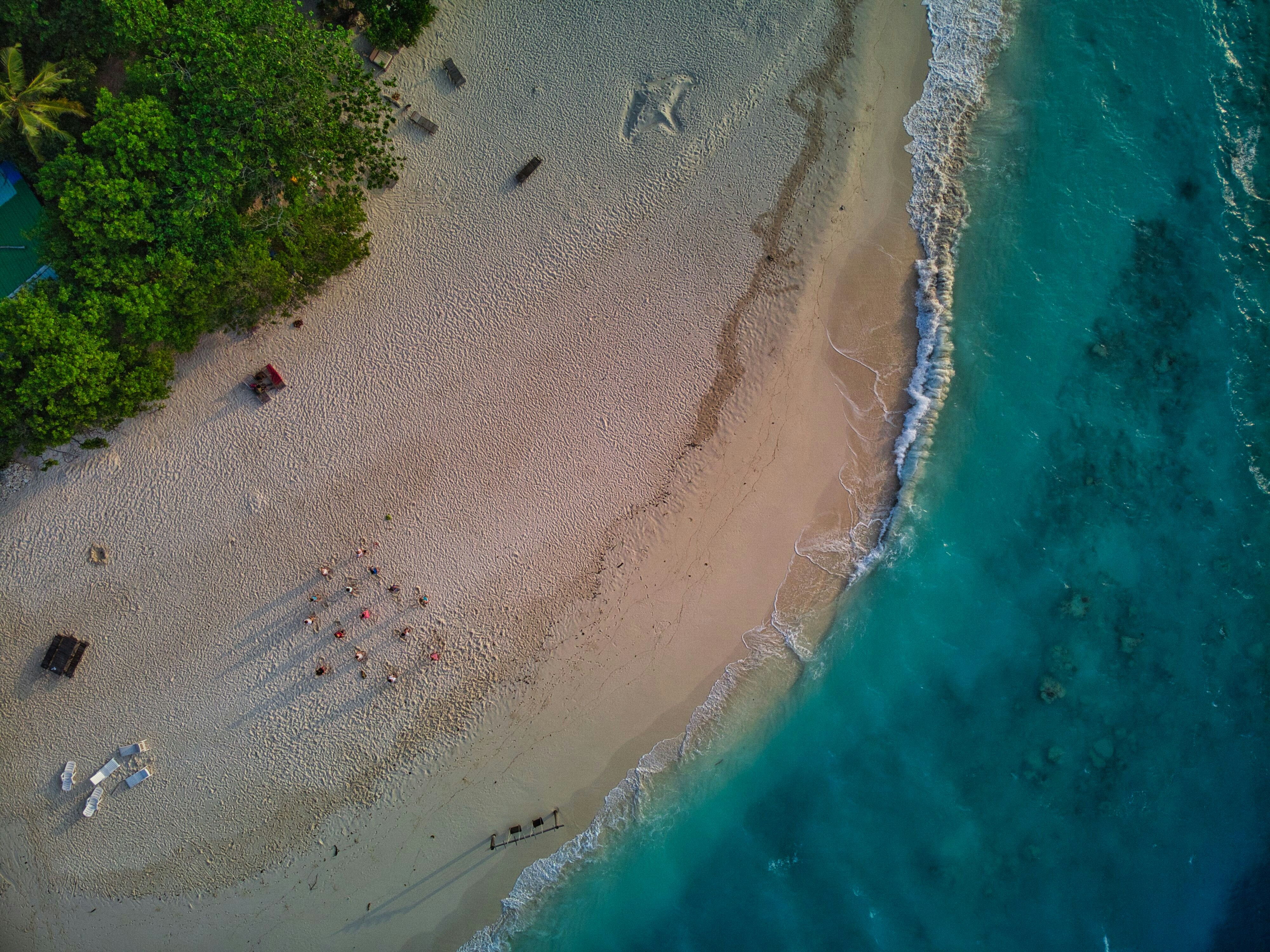 an aerial view of a sandy beach and ocean