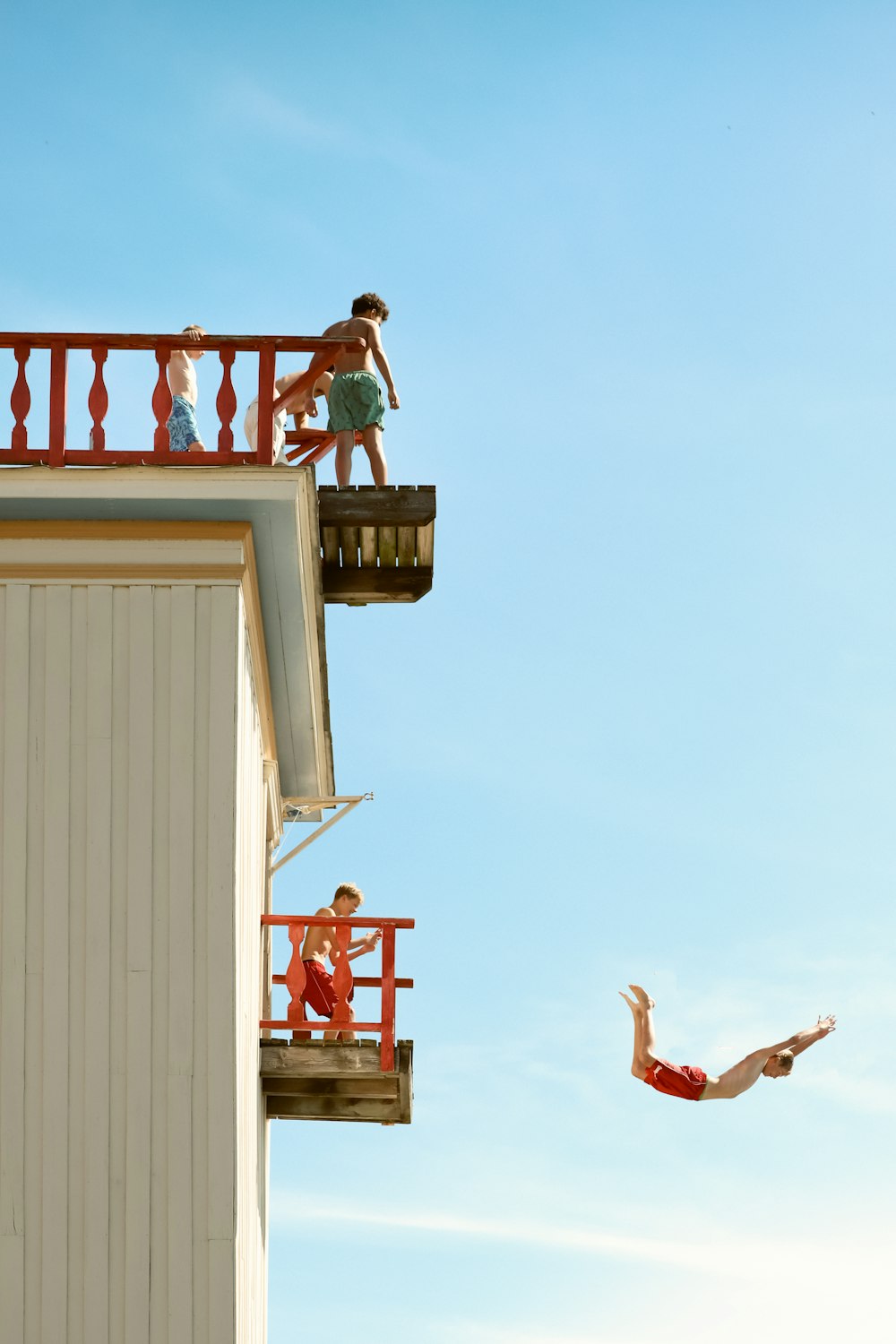 a person jumping into the air from a building