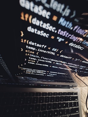 Close-up of a laptop screen showing cybersecurity code being reviewed during a hands-on training.