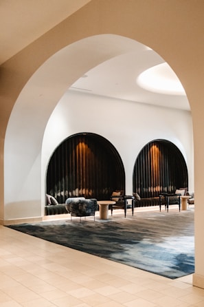 Comfortable patient lounge area with sophisticated black and gold accents.