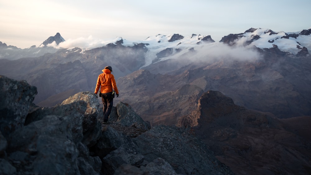 a man standing on top of a rocky mountain