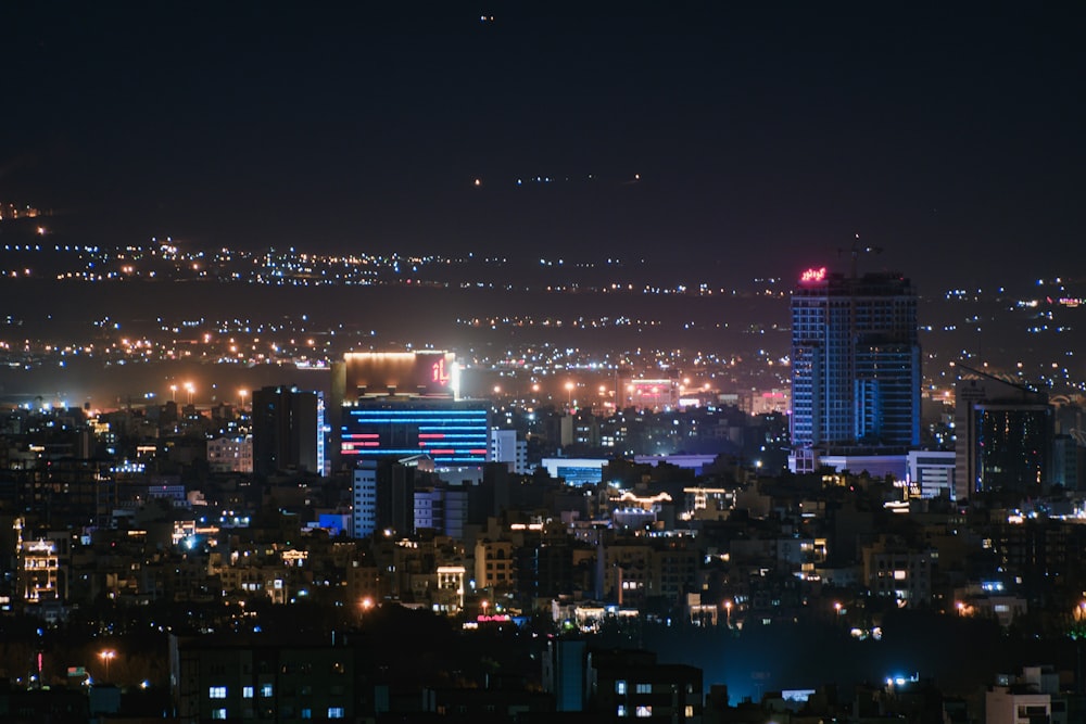 a night view of a city with buildings and lights