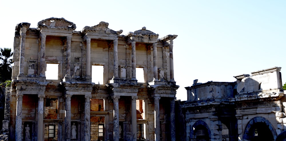 the ruins of a building with a sky background