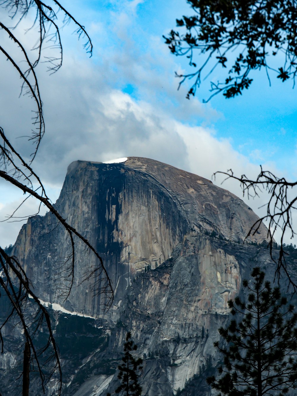 a very tall mountain with a sky in the background