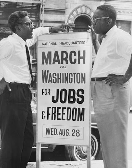 In front of 170 W 130 St., March on Washington, l t[o] r Bayard Rustin, Deputy Director, Cleveland Robinson, Chairman of Administrative Committee.