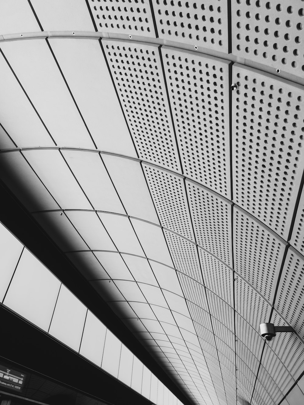 a black and white photo of a ceiling