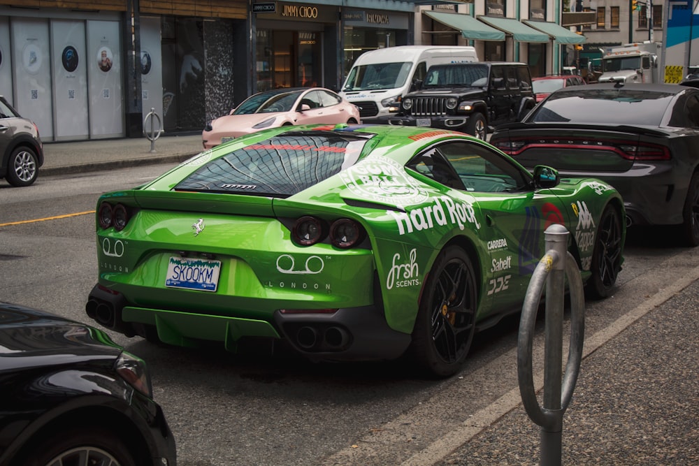 a green sports car parked on the side of the road