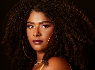 a close up of a person with curly hair