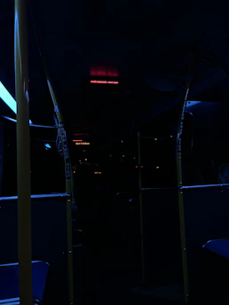 Close-up of a vibrant LED advertising screen inside a city bus showing dynamic content.