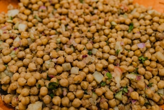a plate full of chickpeas and onions on a table