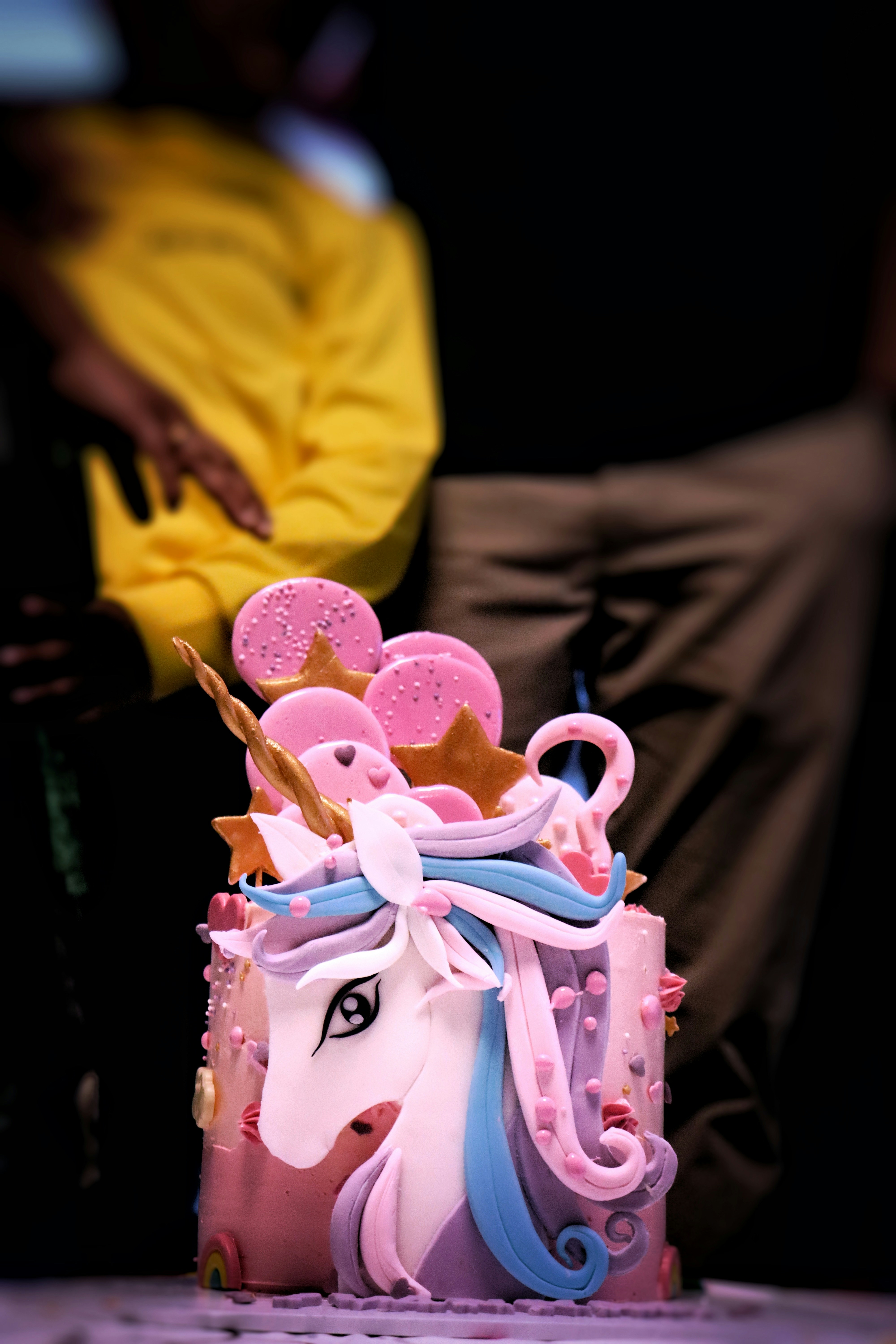 a pink cake with a horse on top of it