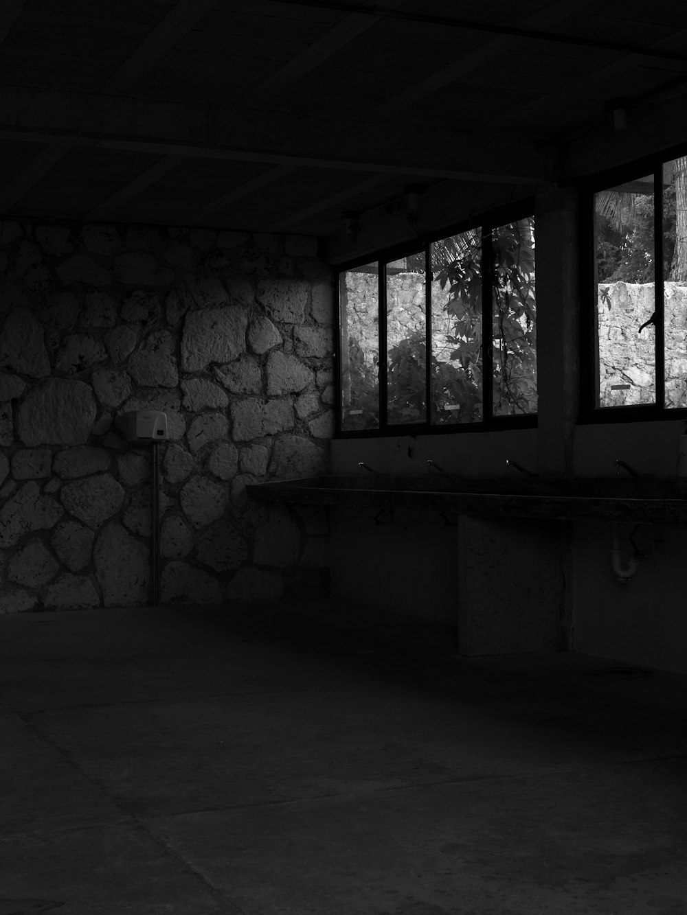 a black and white photo of a stone building