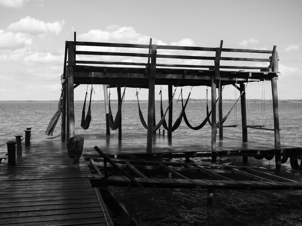 a wooden dock with a boat tied to it