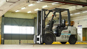 a forklift parked inside of a warehouse