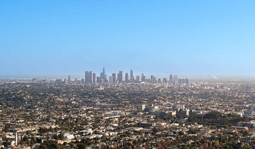 an aerial view of a city with tall buildings