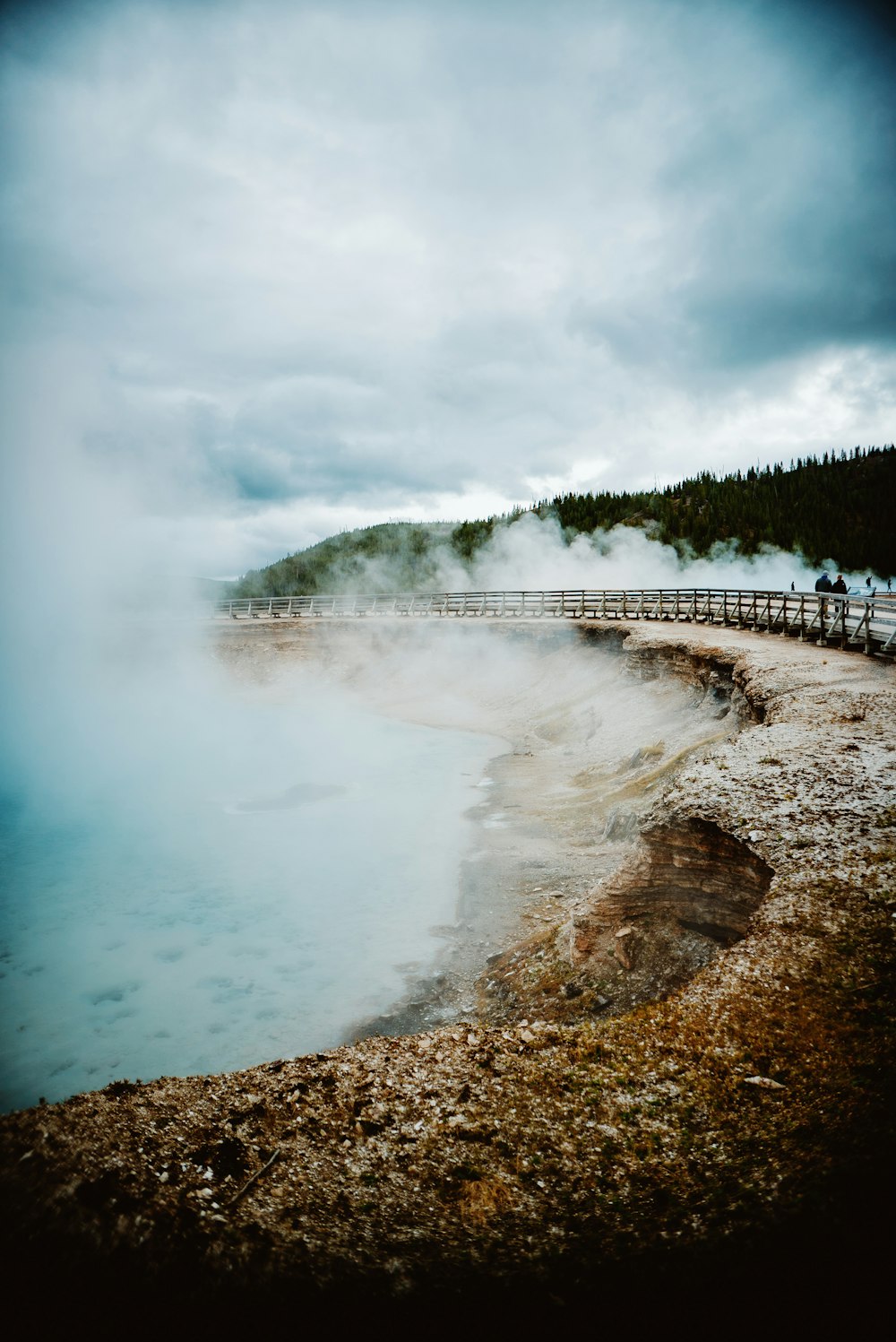 a body of water with steam coming out of it