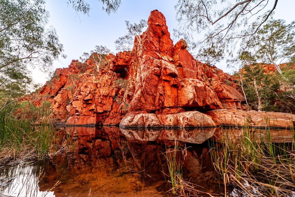 a rock formation in the middle of a body of water