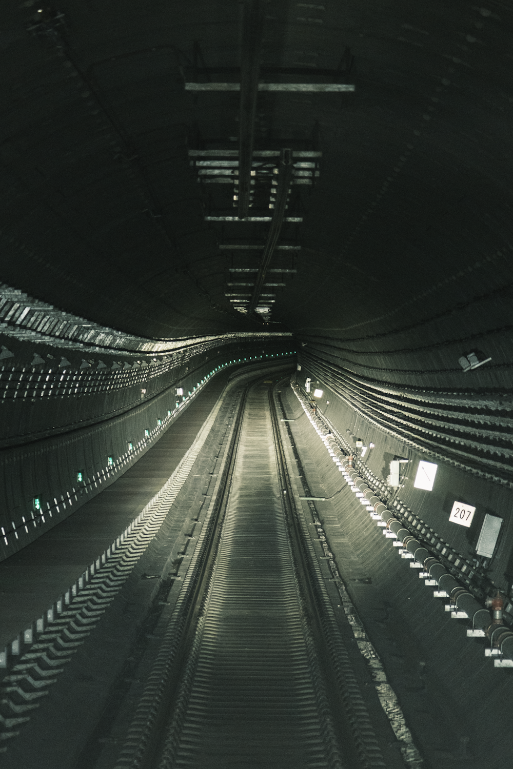 a train tunnel with a train going through it