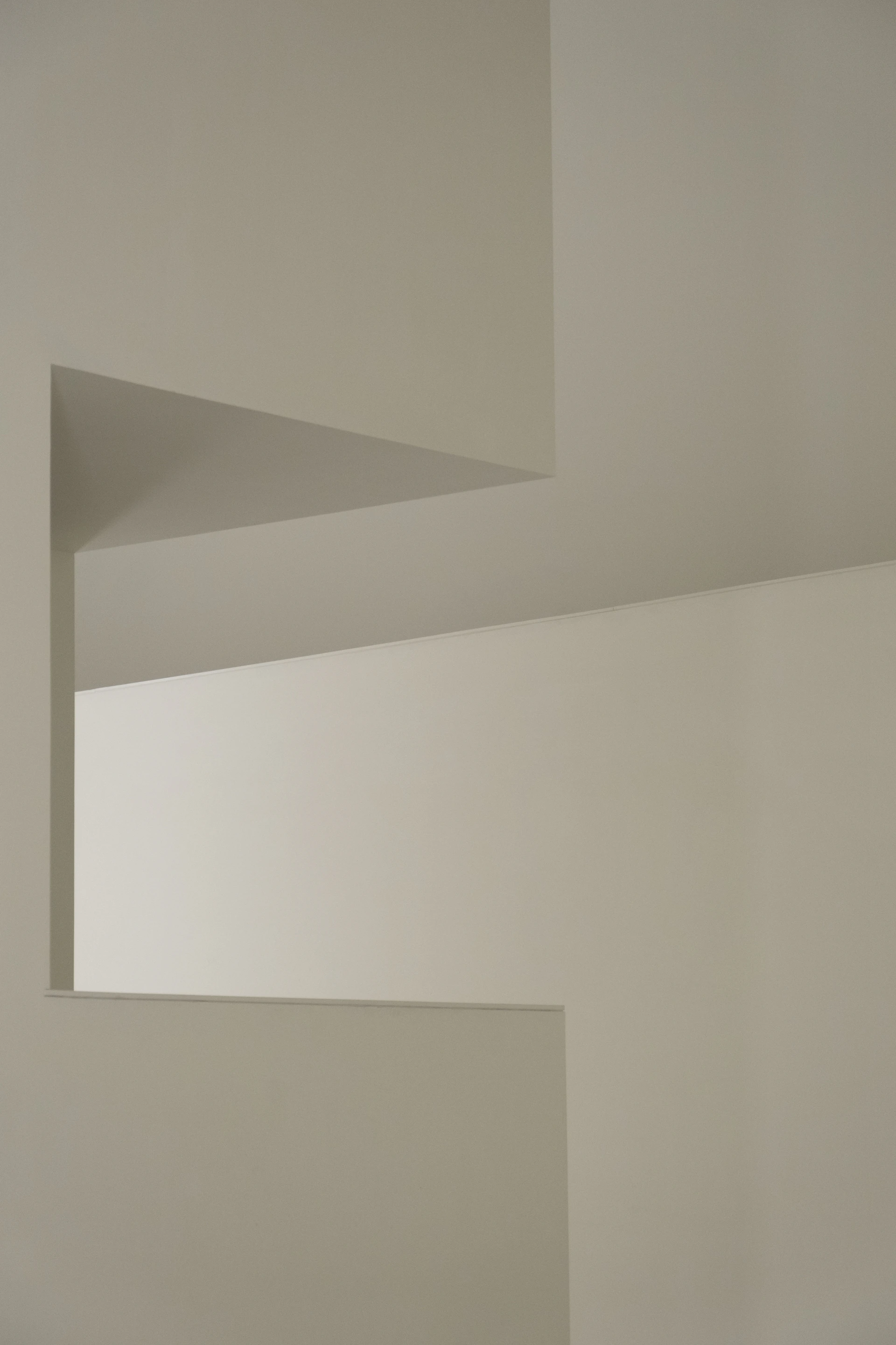 a white room with a white wall and a black and white clock