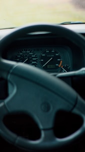 Close-up of a car dashboard showing speedometer and fuel gauge.
