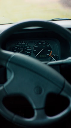 Close-up of a car dashboard showing speedometer and fuel gauge.