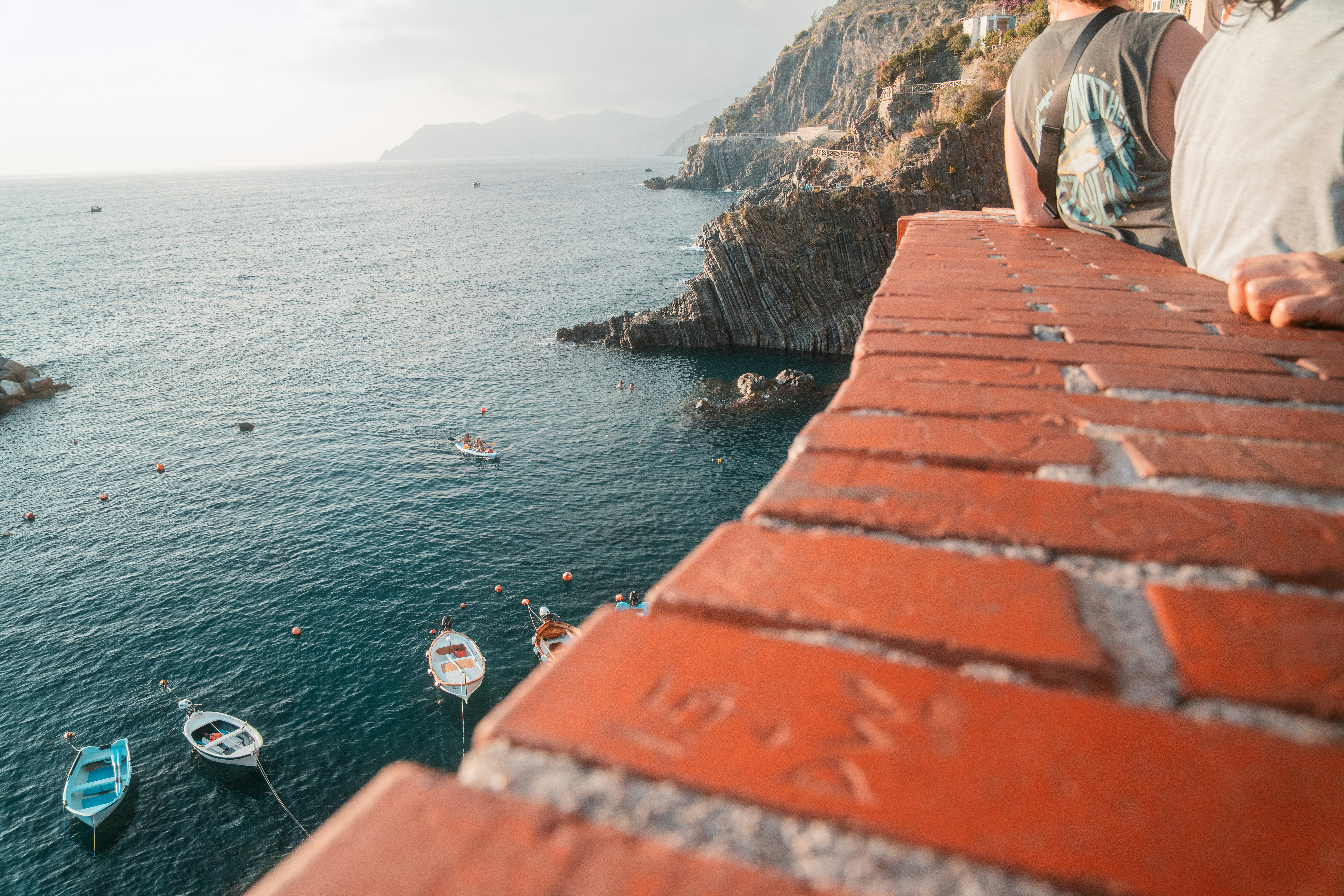 a couple of boats that are sitting in the water, I was in Italy with my Girlfriend and got some great Pictures from Cinque Terre.