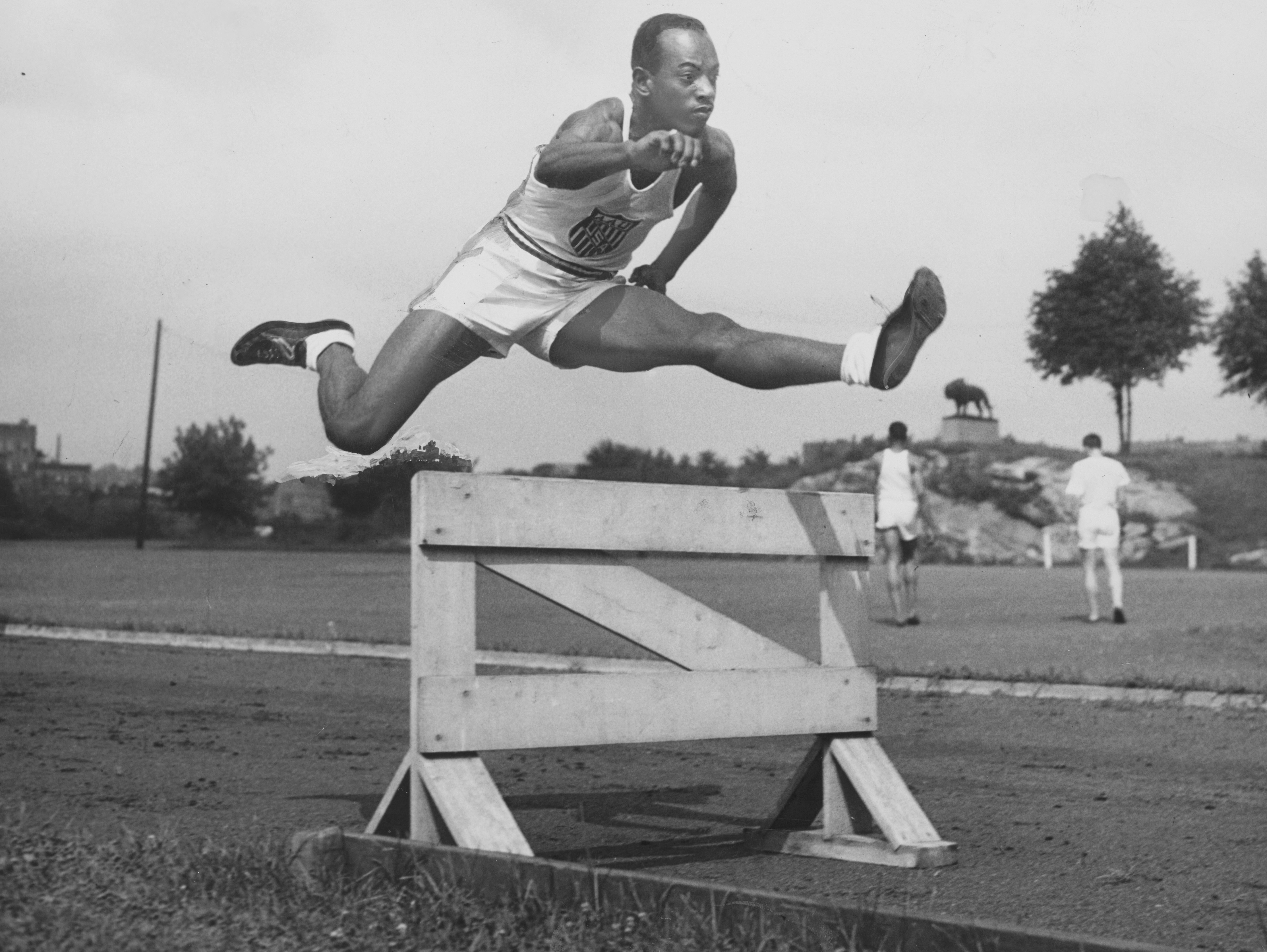 Harrison Dillard, world record holder, jumping a hurdle. photo Free
