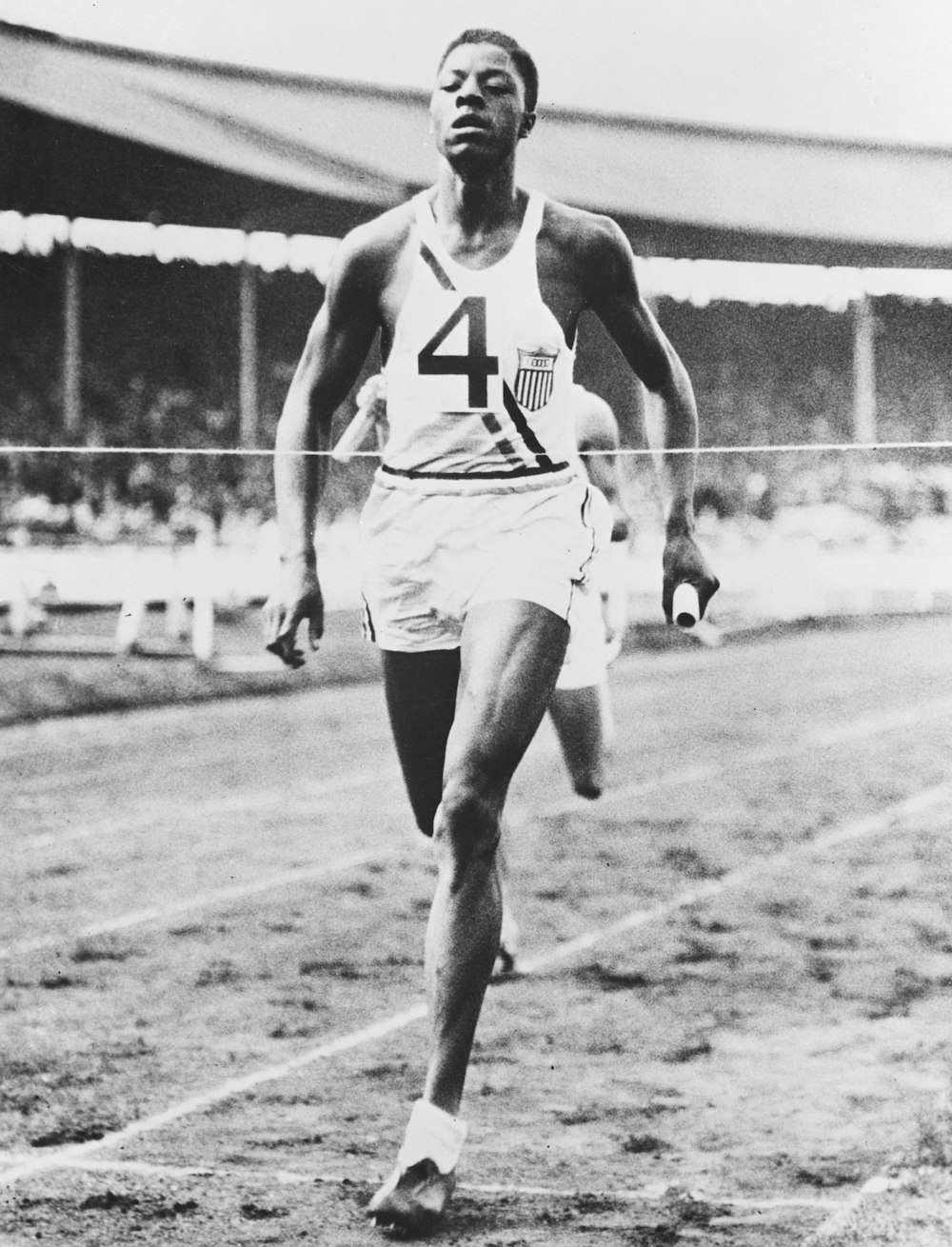John Woodruff #4 running in the two mile relay race at the Olympics, 1936 August 15.