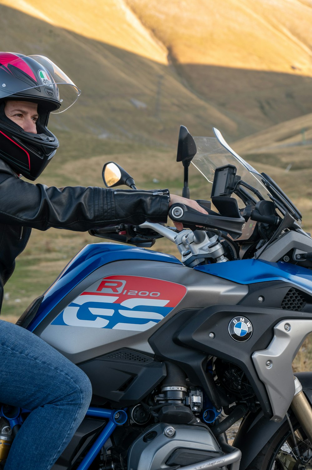 a person wearing a helmet is sitting on a motorcycle