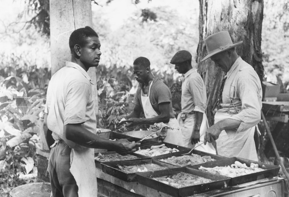 Ky. Cooking a fried supper as a benefit picnic supper which is being given by St. Thomas church Summary Photograph shows African American men cooking at an outdoor stove.