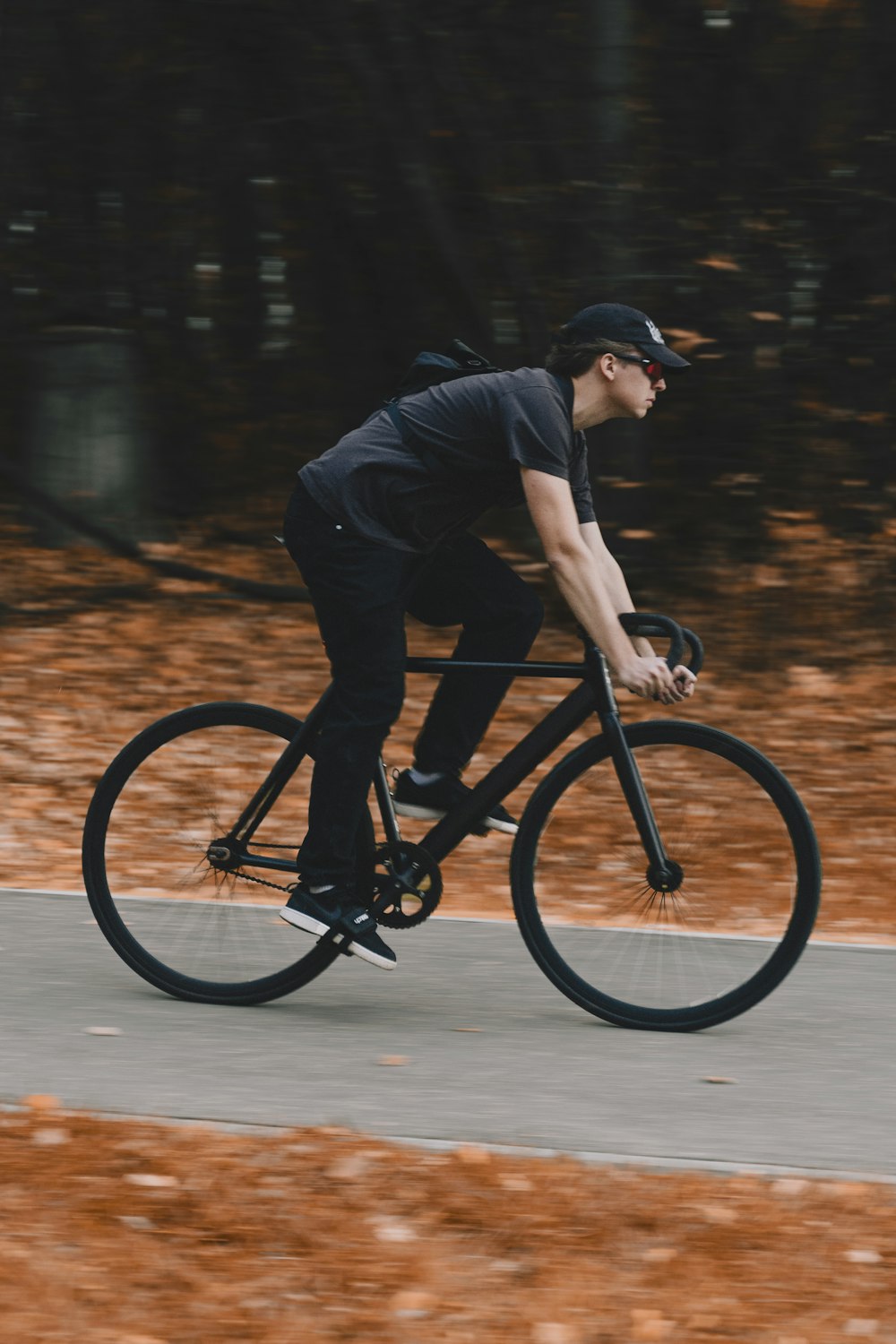 a man riding a bike down a street