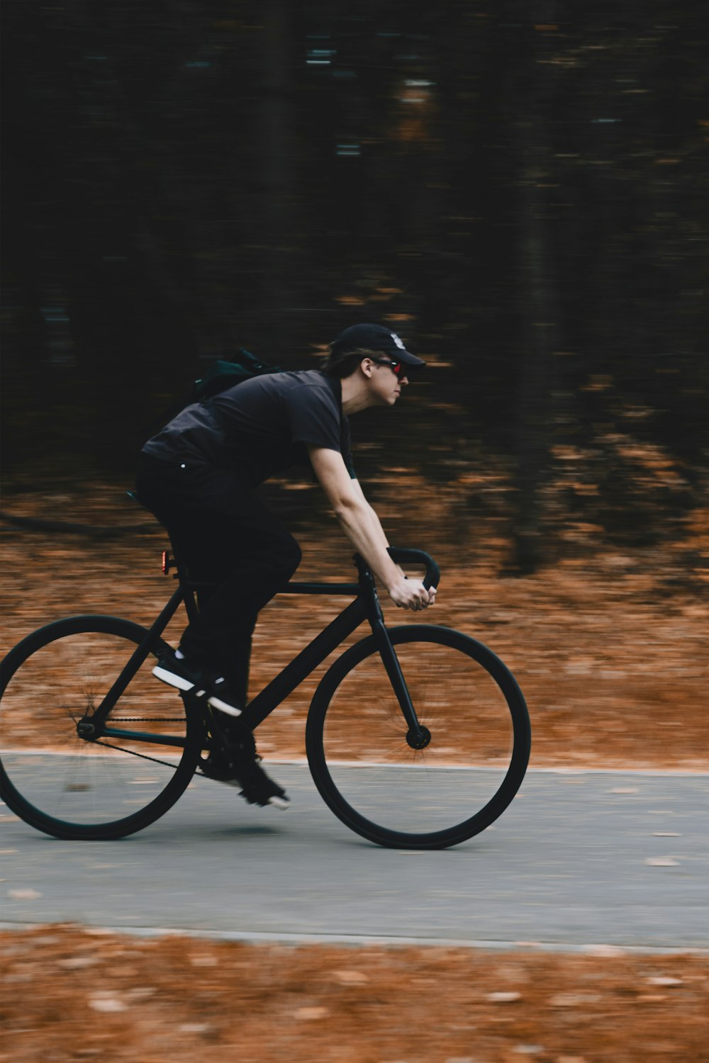 a man riding a bike down a street