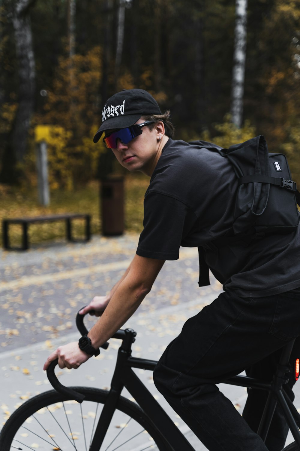 a man riding a bike down a street