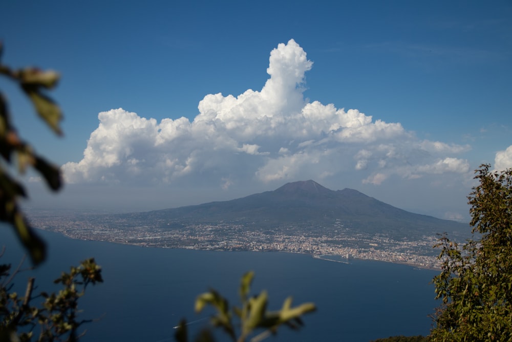 a view of a large body of water with a mountain in the background