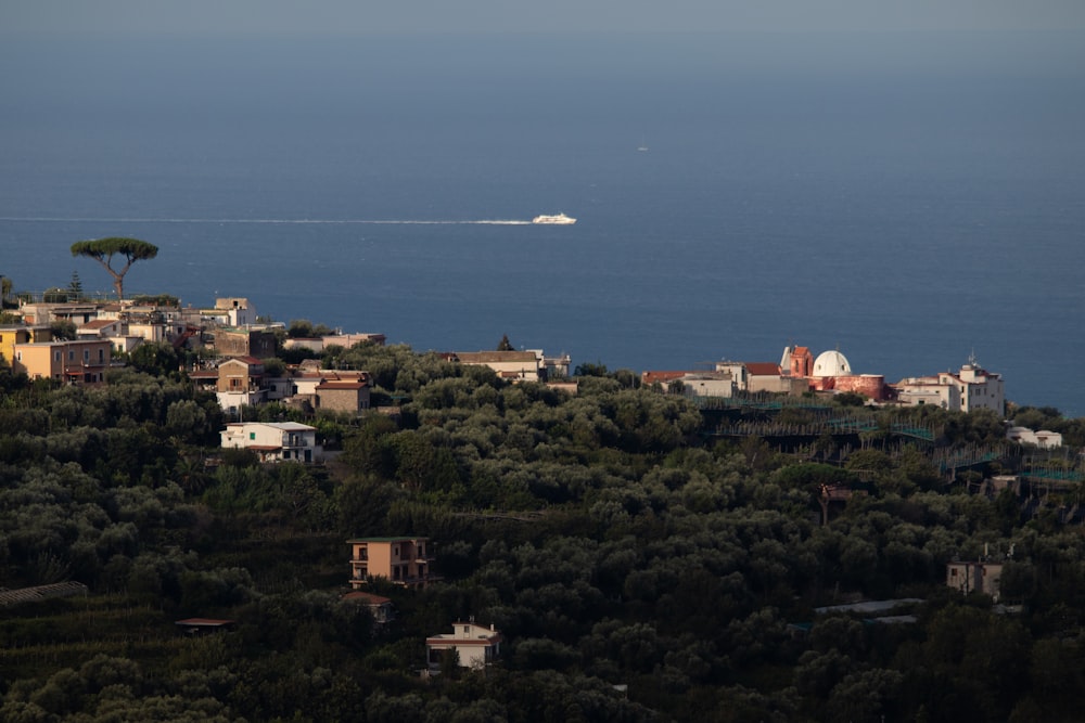 a small boat is in the distance on the water