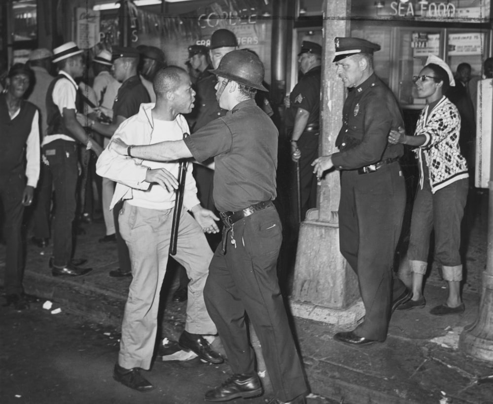 Confrontation between African Americans and police with billysticks.