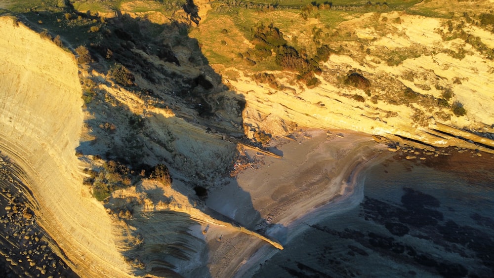 an aerial view of a beach and cliffs