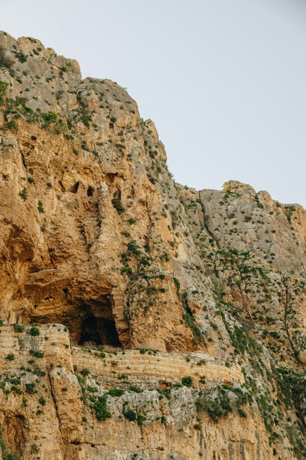 a mountain with a cave in the middle of it