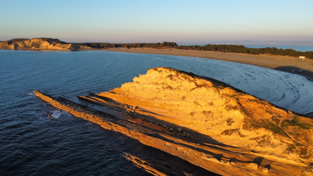 a large body of water next to a sandy beach