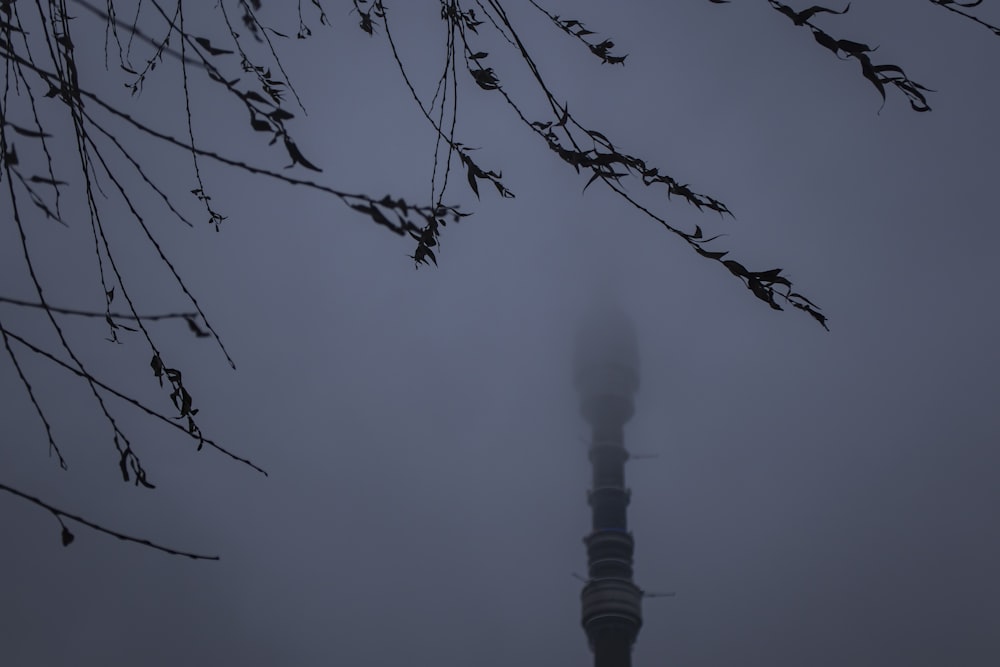 a tall tower with a clock on it's side