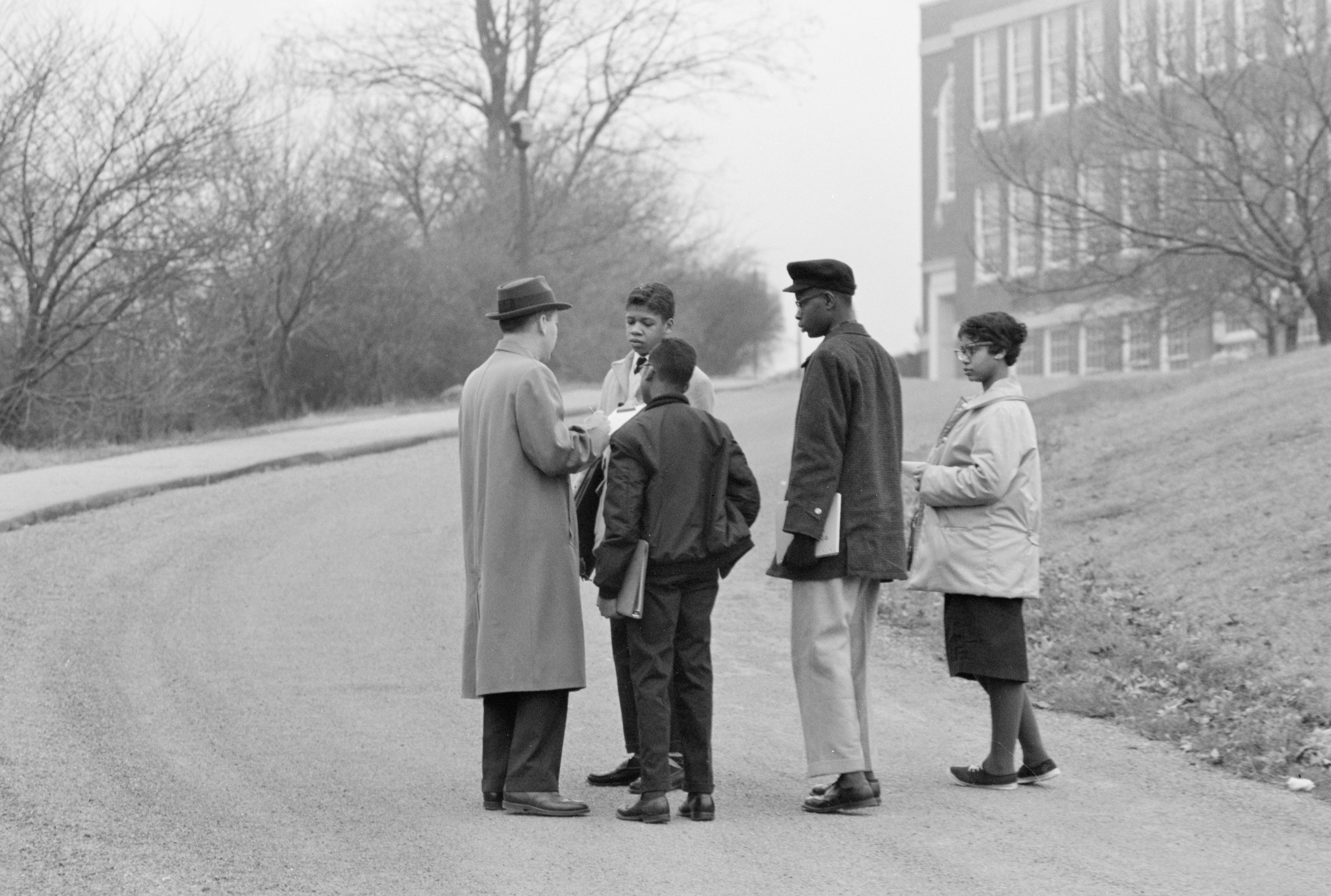 African American students with F. Brent Sandidge, General Supervisor of Instruction for Warren and Rappahannock counties, outside Warren County High School, Front Royal, Virginia, during school integration.